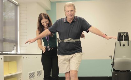 PhD student Jacinta Foster helps a study participant gather personalised information using the device. UQ image.